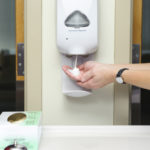 Using hand sanitizer