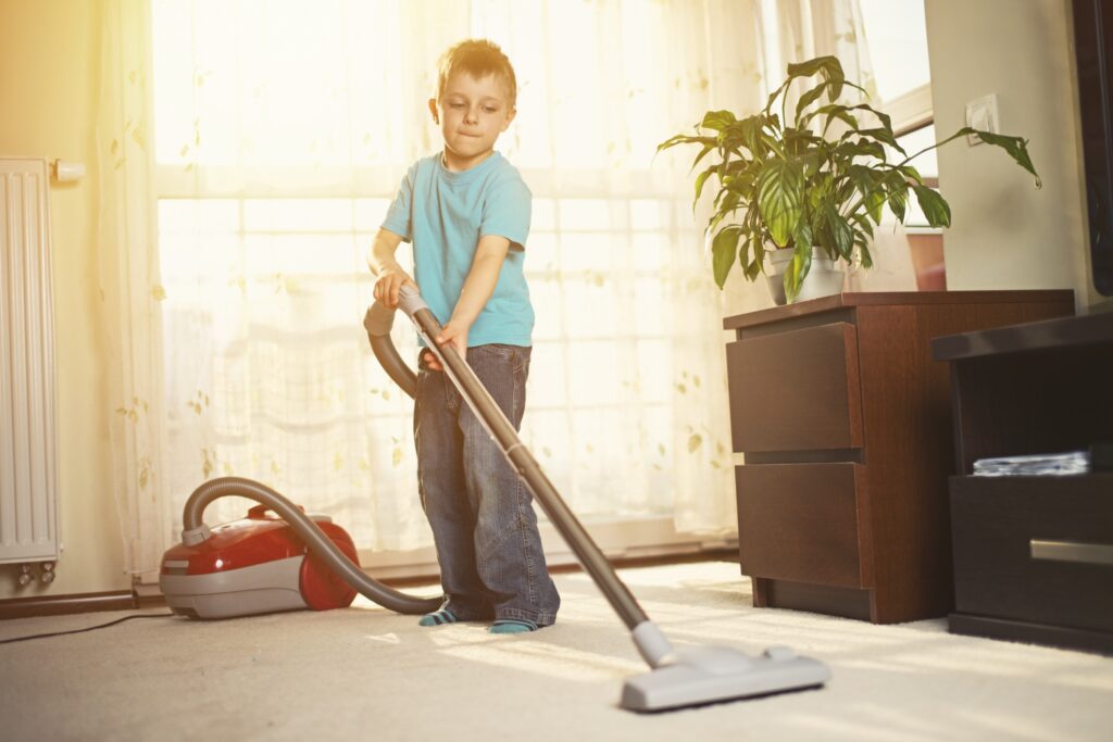 child vacuuming